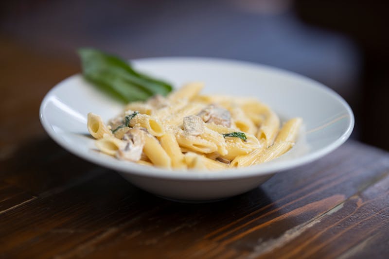 Penne pasta with creamy alfredo sauce and grilled chicken